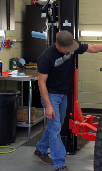 Jordan in the Savage Powersports service bay