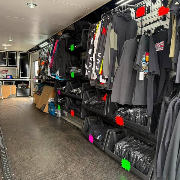 The apparel wall inside the Savage trailer