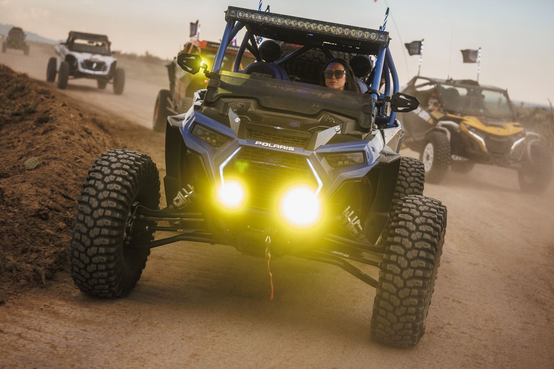 Polaris RZR with light bar in the dust