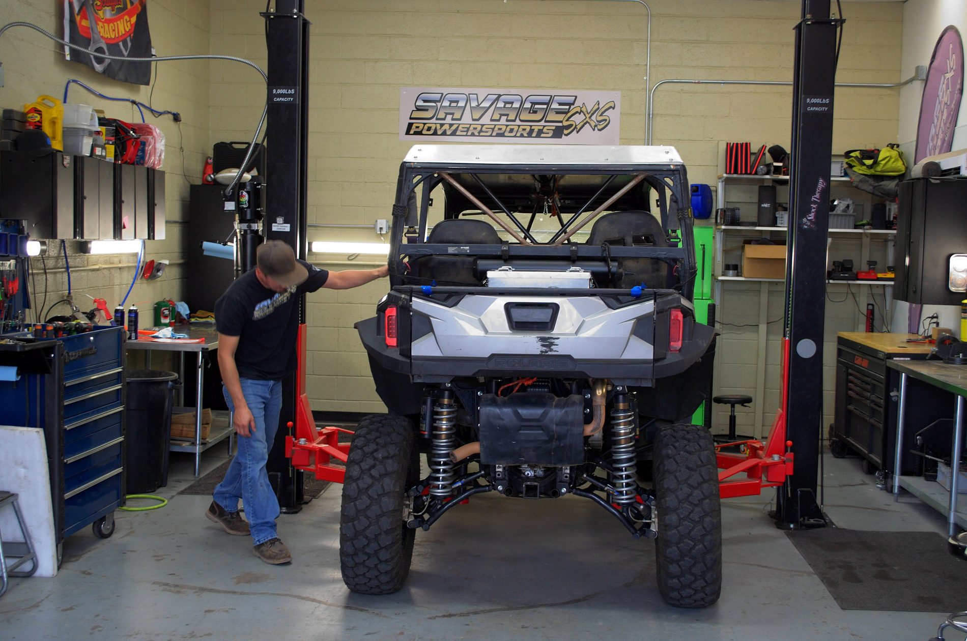 Polaris General on the lift in the Savage Powersports service bay, Pueblo