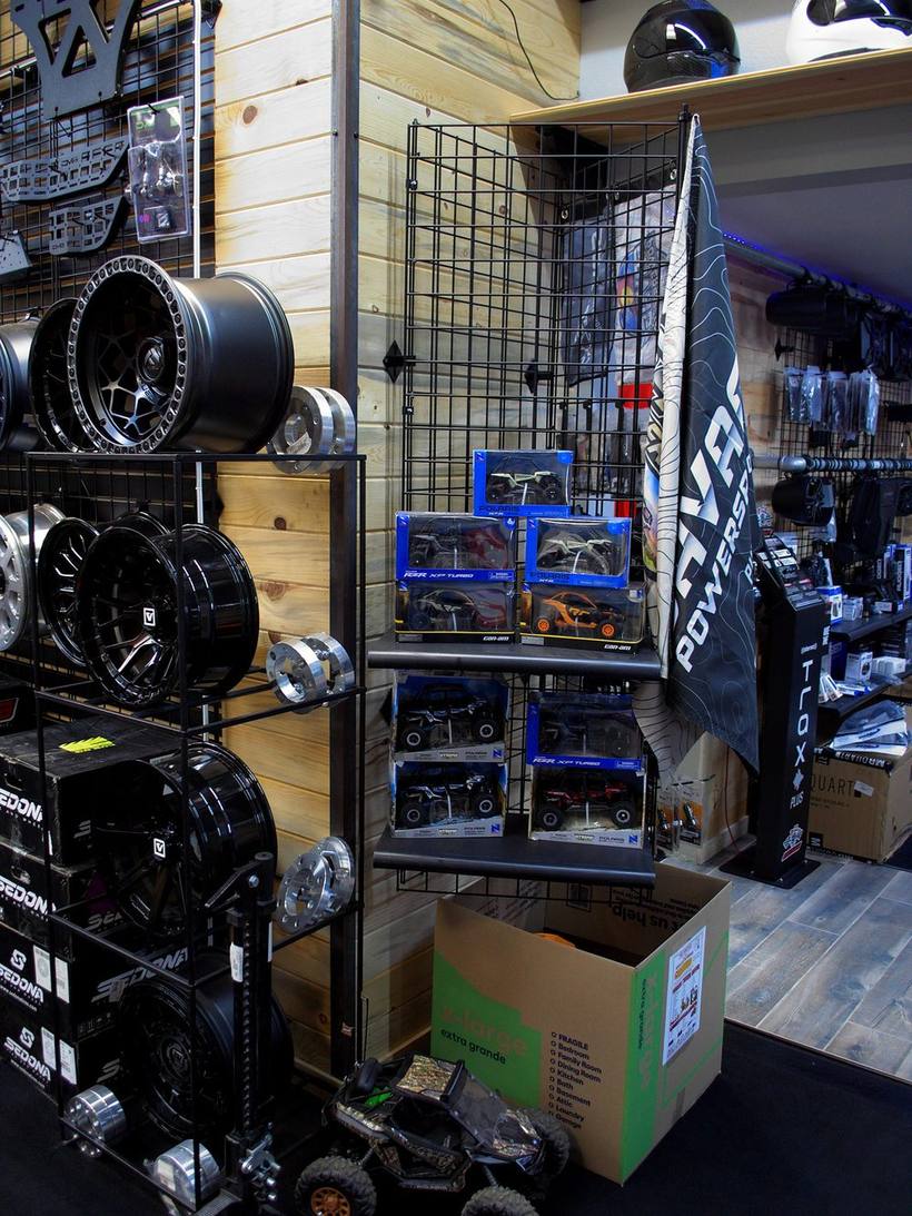 Wheels, tires and accessories on the wall inside Savage Powersports